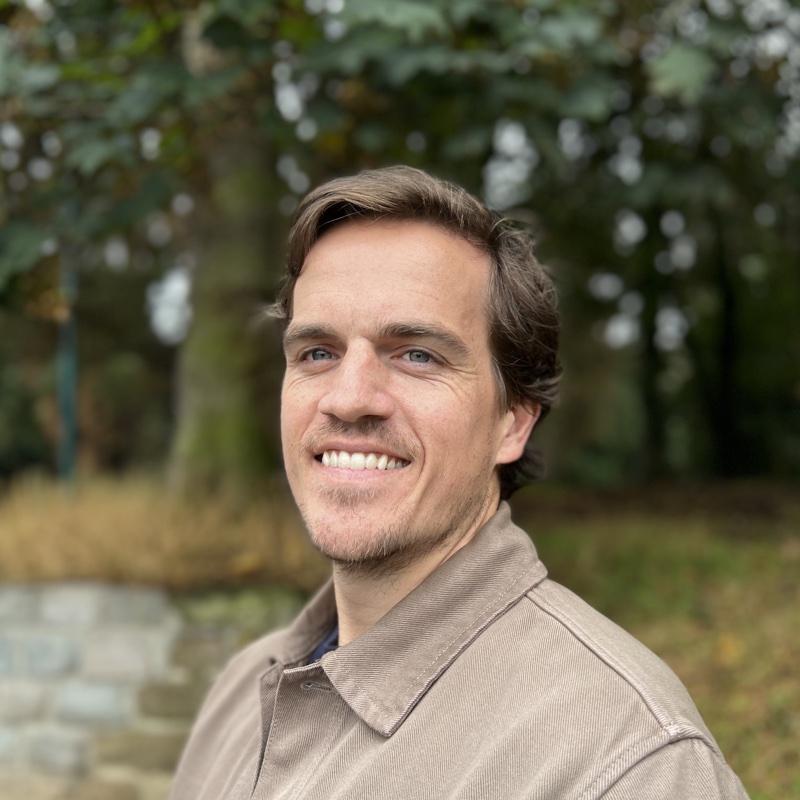 Ryan Wigley, outdoors, smiling.